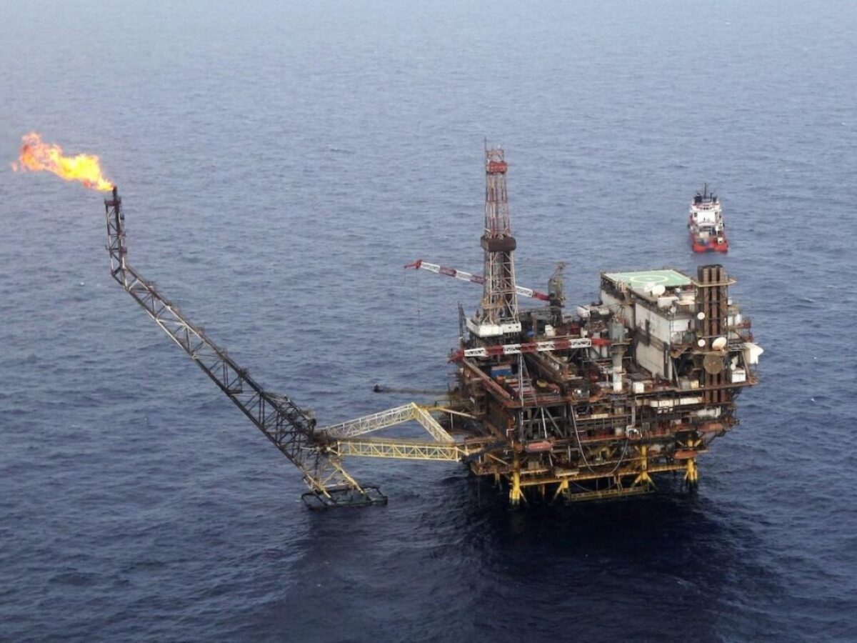 Offshore oil platform in the ocean at twilight